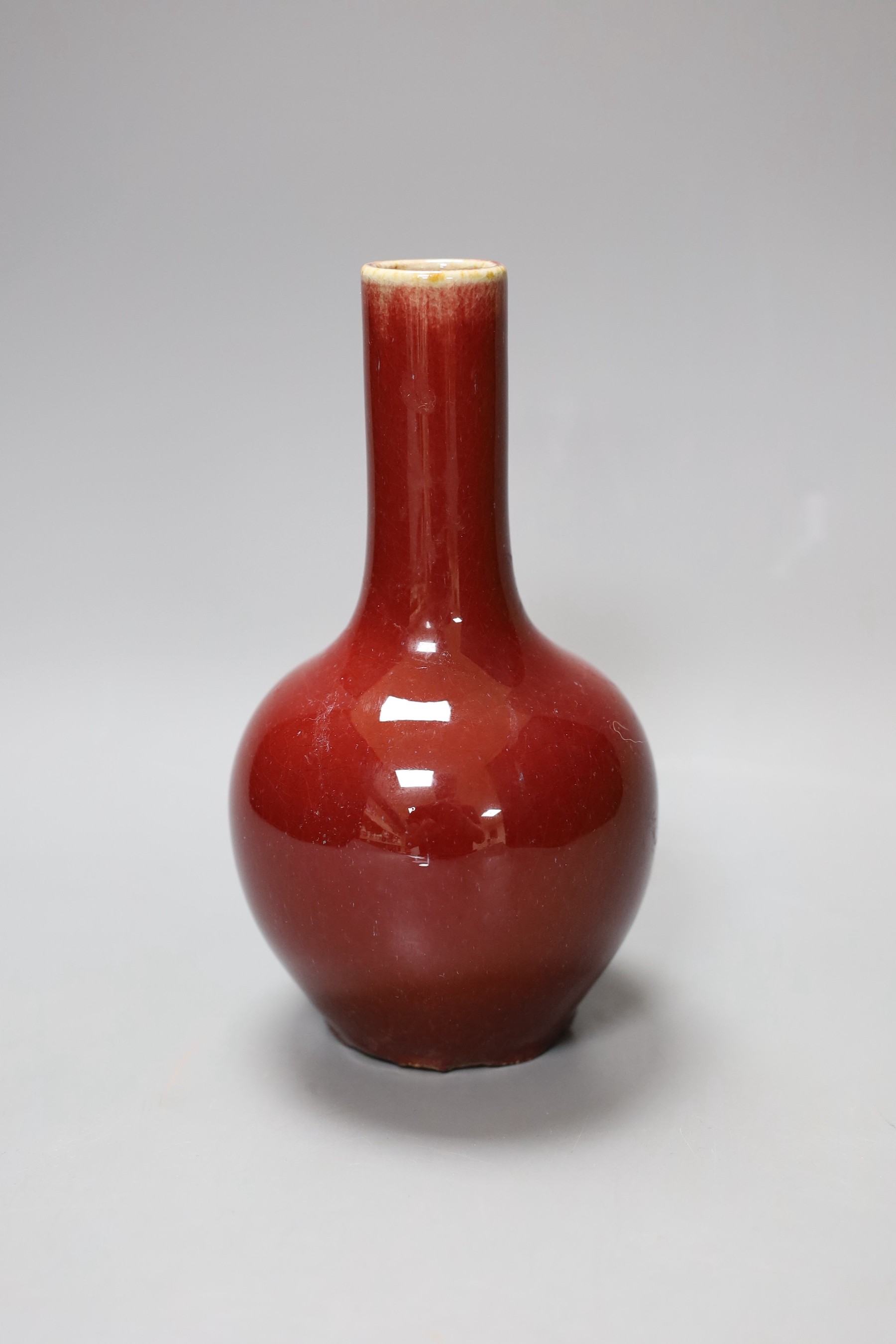 A small Chinese sang de boeuf bottle vase, 18cm tall